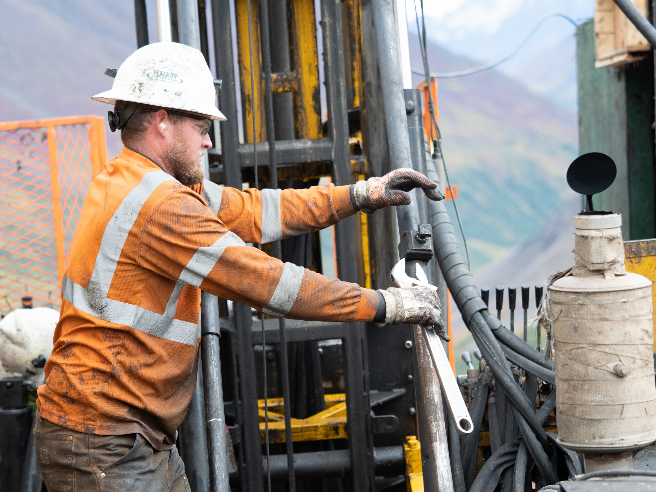 Photo of a driller operating the drill rig