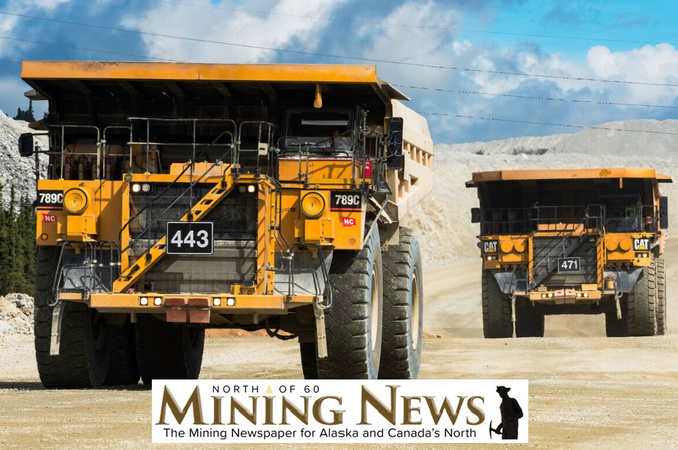 Photo of 2 mining trucks at the Fort KNox mine in Alaska